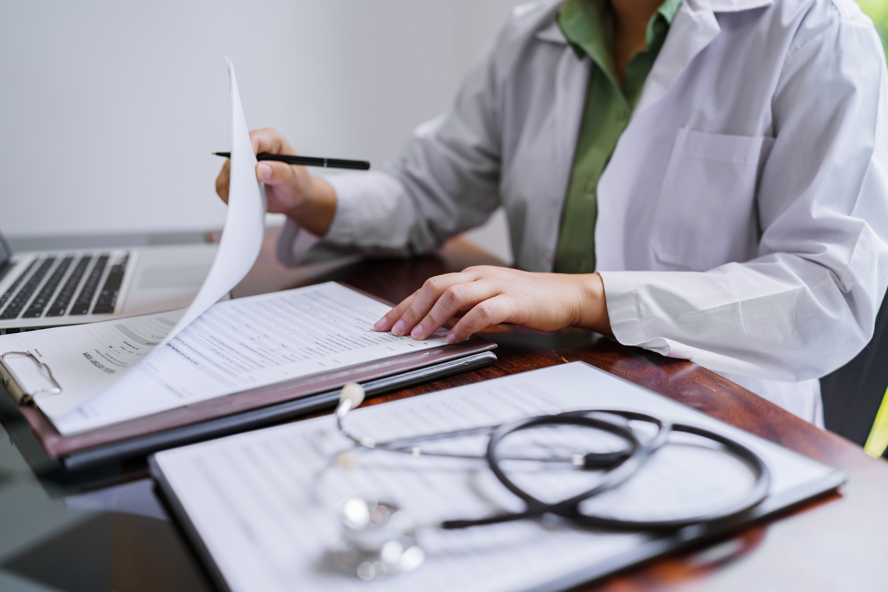 Professional medical doctor in white uniform gown coat interview